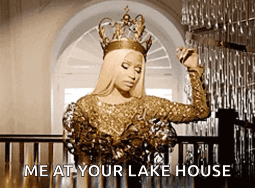 a woman wearing a crown is standing on a staircase and says me at your lake house .