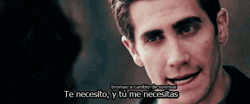 a close up of a man 's face with the words te necesito y tu me necesitas