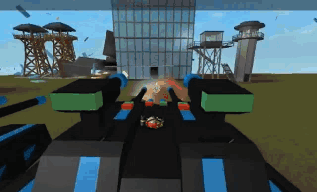 a video game is being played in front of a building and a tower