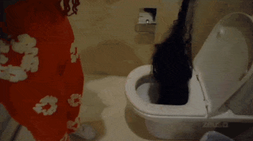 a toilet with a lot of hair coming out of it .