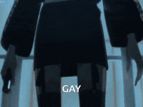 a person standing in a dark room with the word gay written on the bottom