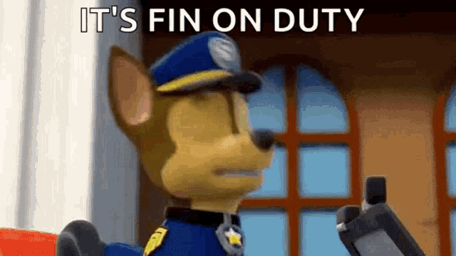 chase from paw patrol is holding a cell phone in his hand .