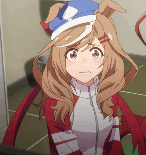 a close up of a girl with a blue hat and ears