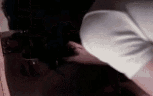 a close up of a woman 's butt in a white shirt .