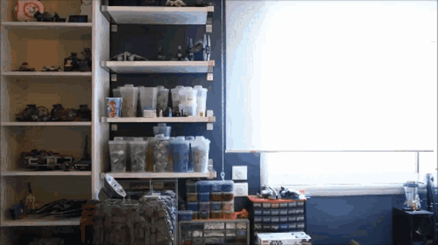 a lego box sits on a shelf in a room with lots of shelves