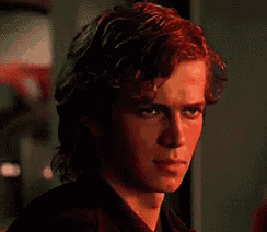 a close up of a man 's face with a red light shining on it .