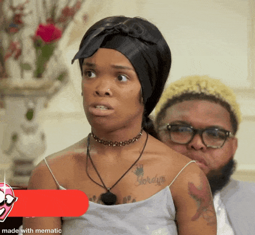 a woman with the name jordan on her chest is sitting next to a man