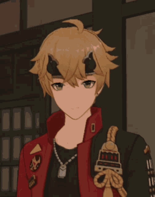 a close up of a person 's face with a red jacket and a black shirt