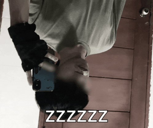 a man is taking a picture of himself with the words zzzz on the bottom right