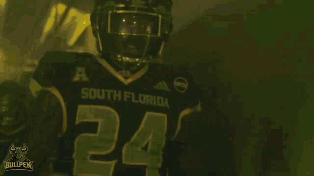 a football player wearing a jersey that says south florida on it
