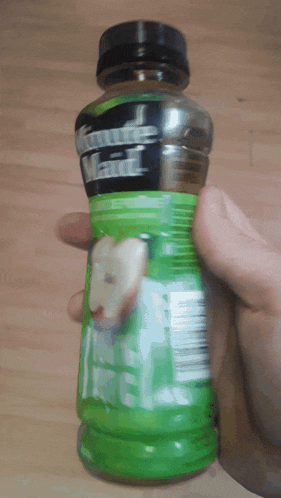 a person is holding a bottle of future maid