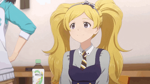 a girl with blonde hair is sitting in front of a bottle that says " green tea " on it