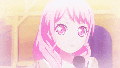 a girl with pink hair is holding a microphone in her hand