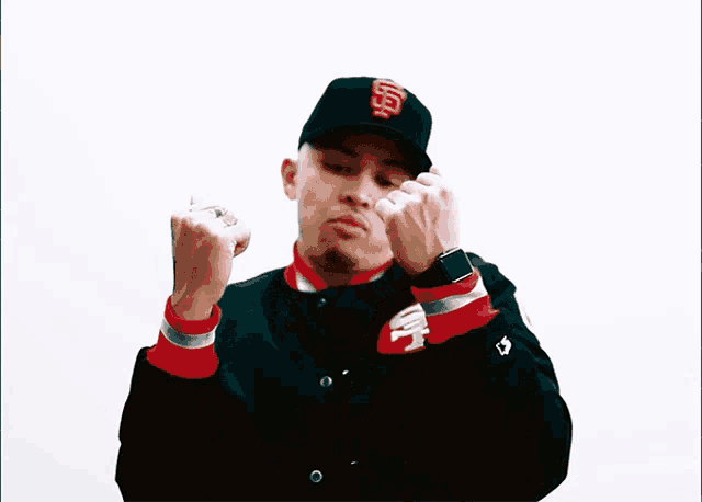 a man wearing a san francisco 49ers jacket and hat