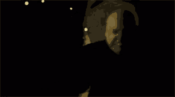 a blurry picture of a person taking a picture of themselves in the dark .