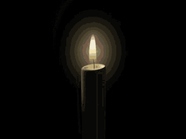 a candle with a picture of a man and the letter z on it