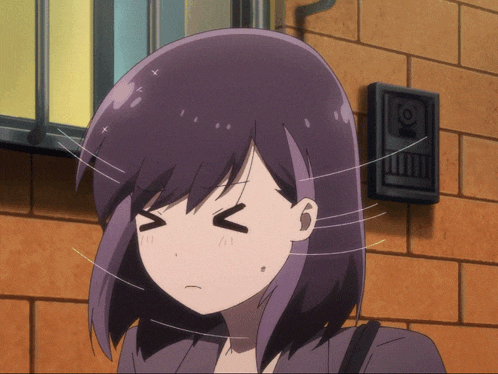 a girl with purple hair is making a face with her eyes closed