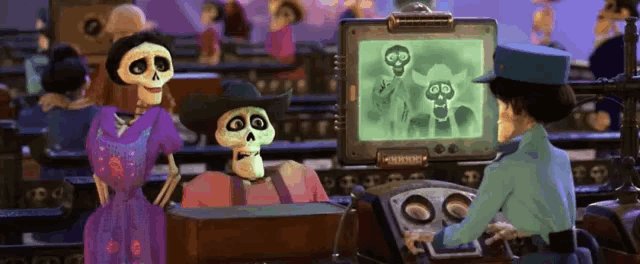 a couple of skeletons are standing next to a police officer in front of a computer monitor .