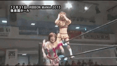 a woman is riding another woman in a wrestling ring during a ribbon mania 2015 event .