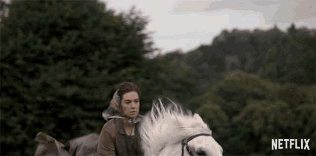 a woman riding on the back of a white horse with netflix written on the bottom