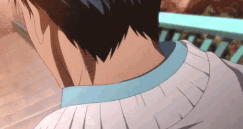 a close up of a person 's neck and neckline in a white shirt .