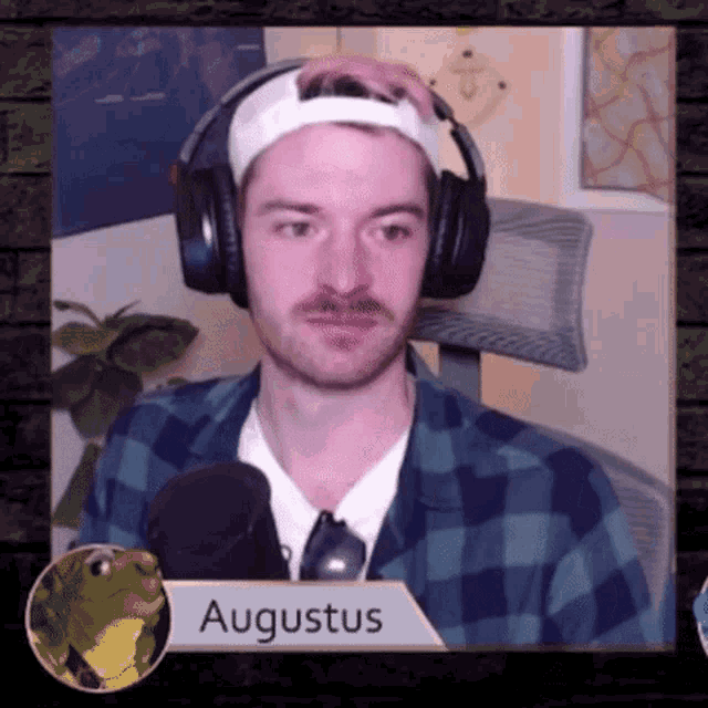 a man wearing headphones and a headband with the name augustus on the bottom