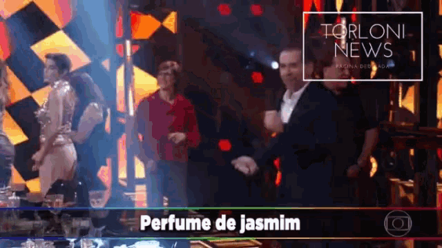 perfume de jasmim is being advertised on a television screen