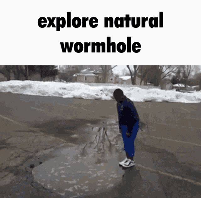 a person standing in a puddle with the words explore natural wormhole written above them
