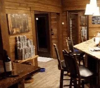 a bottle of wine sits on the counter in a kitchen