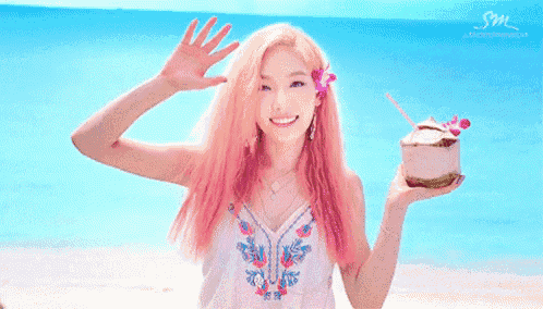 a woman with pink hair is holding a coconut and smiling