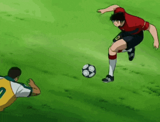 a soccer player wearing a red jersey with the number 10 on it is kicking the ball