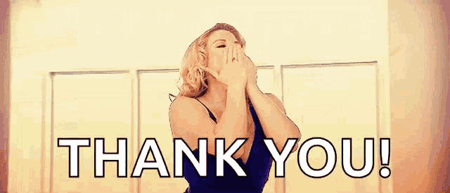 a woman is covering her mouth with her hand and the words `` thank you '' are behind her .