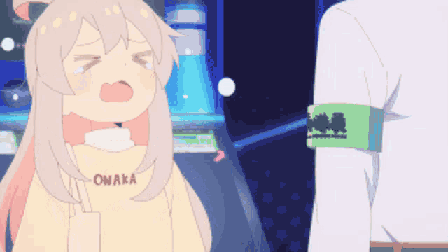 a girl wearing a sweatshirt that says owaka on it