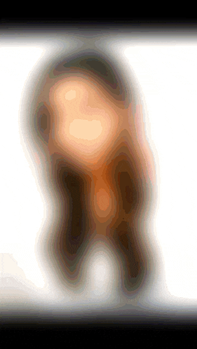 a blurred image of a person 's face with a white background and a black border