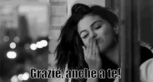 a black and white photo of a woman blowing a kiss with the words `` grazie anche a te ! ''