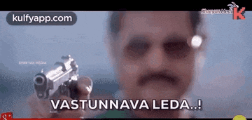 a man holding a gun with the words vastunnava leda written on it