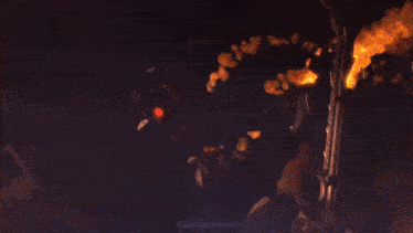 a close up of a fire with the word spider around