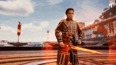 a man in a blue and gold uniform is holding a large sword