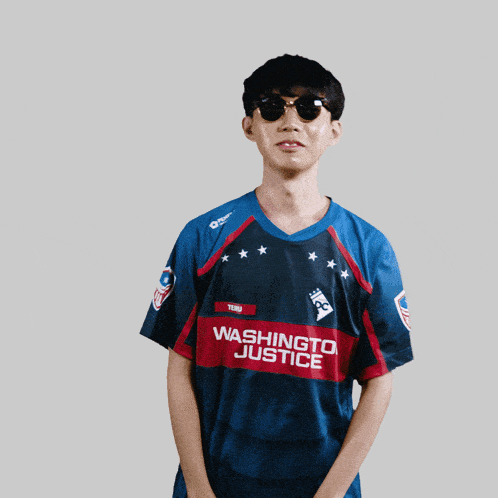 a man wearing a washington justice jersey and sunglasses