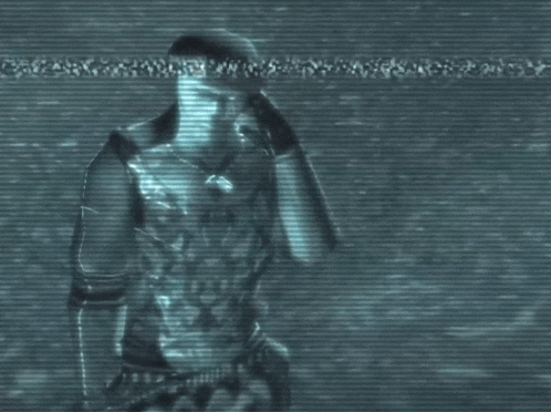 a man with a necklace around his neck is walking in a dark room