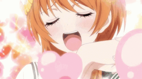a girl in a school uniform is holding a pink heart in her hands .