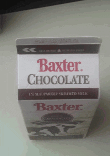 a carton of baxter chocolate milk is on a table