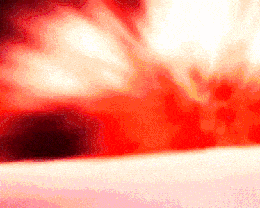 a red and white background with a blurred texture