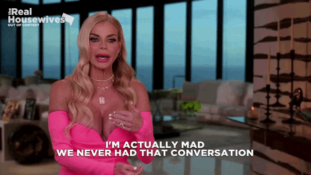 a woman in a pink dress with the words i 'm actually mad we never had that conversation below her