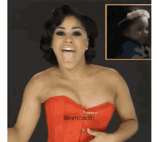 a woman in a red dress is making a funny face with her tongue out .