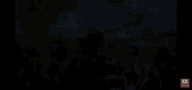 a black screen with a subscribe button in the corner