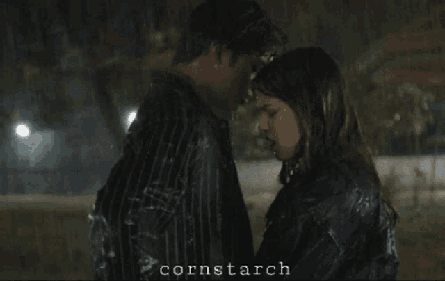 a man and a woman hugging in the rain with cornstarch written on the bottom