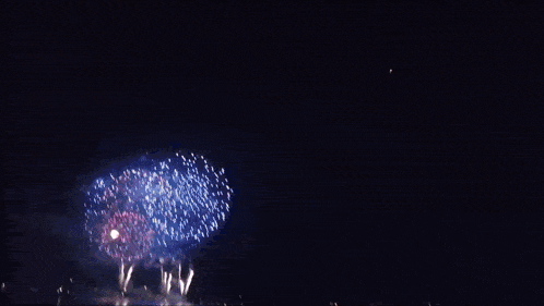 a heart shaped fireworks display in the dark