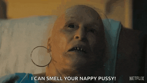 a woman with a bald head is laying in a hospital bed .