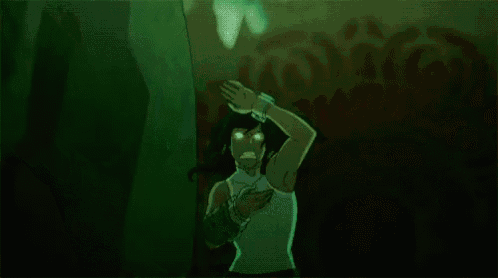 a cartoon character is standing in front of a large green rock .